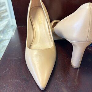 Lovely  Stuart Weitzman  nude leather pumps.